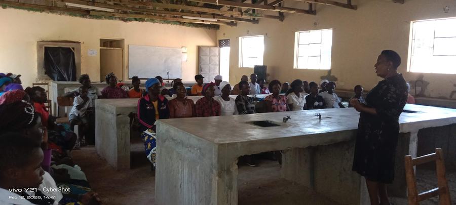 Community health officer addressing parents