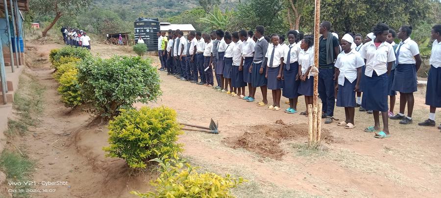 Students at attention during assembly